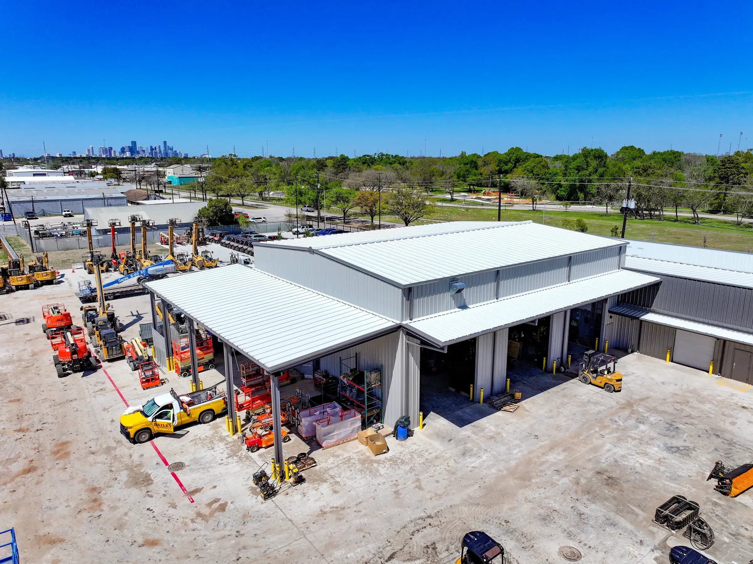Aerial view of the service building with the Houston skyline on the horizon