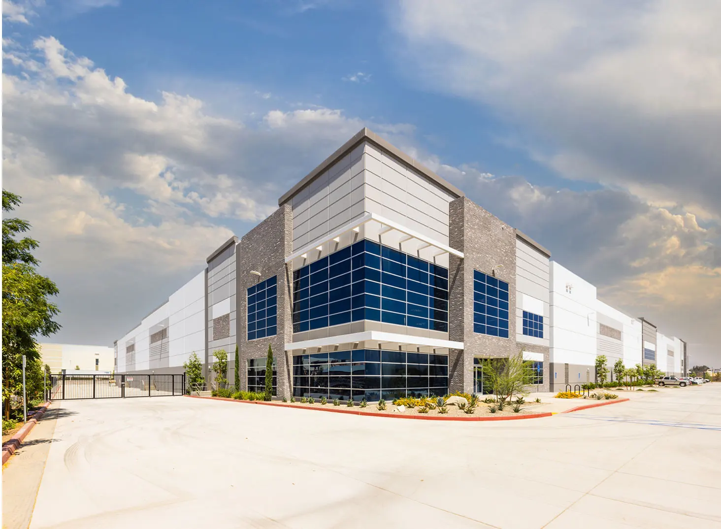 The finished commercial building — the same corner-entry design, built and open